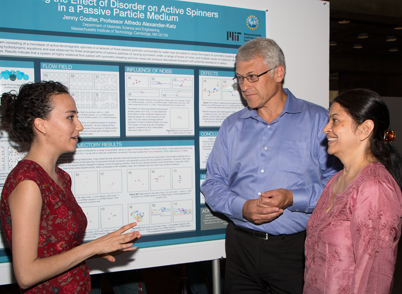 At a poster session on Aug. 4, MPC-CMSE Summer Scholar Jennifer Coulter (left) explains her project modeling how spinning particles moved through a fixed array to Materials Processing Center Associate Director Mark Beals and MIT Microphotonics Center Principal Research Scientist Anuradha Agarwal. 
