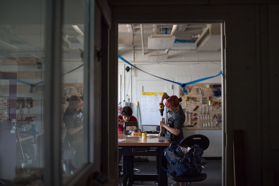 Juan Romero (left), a junior in mechanical engineering, and Marlo Johnson, a sophomore in MechE and a MakerLodge mentor, work on their latest inventions.