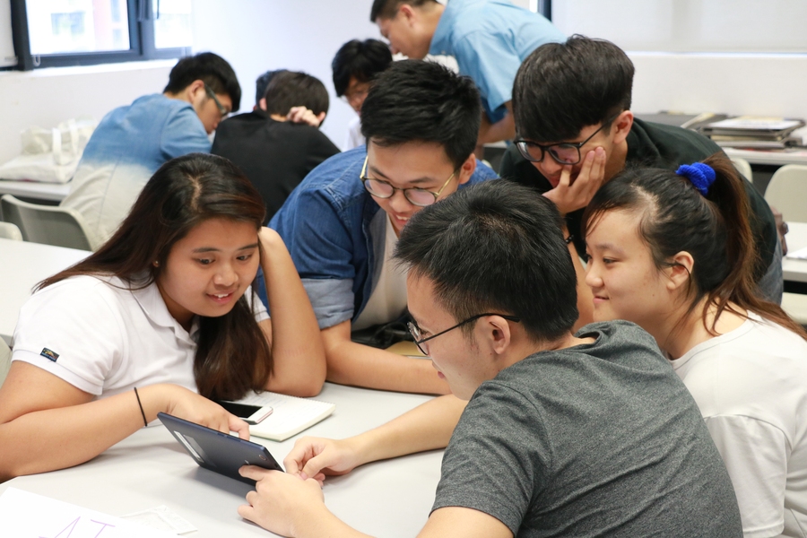 Students in Hong Kong play the socially responsible real estate game.