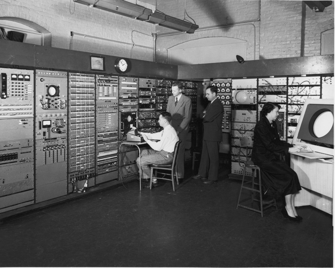 Forrester (second from left) stands in the operations center for Whirlwind I, the early computer project he oversaw at MIT, circa 1951. 