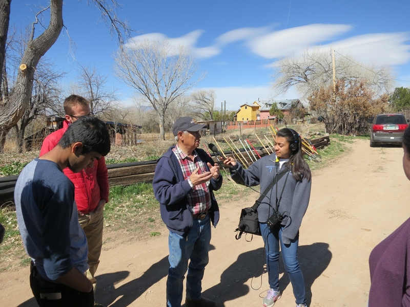 Ted Trujillo, a farmer in Northern New Mexico, explains acequias, a traditional system of communally governed irrigation ditches, to MIT student Milani Chatterji-Len.