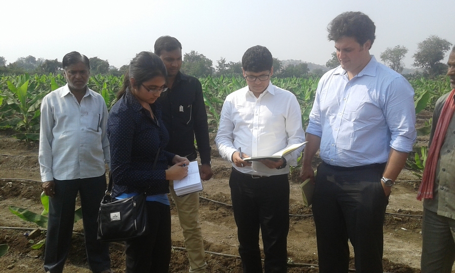 Pulkit Shamshery (fourth from left) gets a better understanding of farmers' irrigation needs and their current irrigation system in Jalgaon, Maharashtra, India. Shamshery is joined by Jaya Narain, second from left, of the MIT Department of Mechanical Engineering (MechE), and MechE Professor Amos Winter (second from right). 
