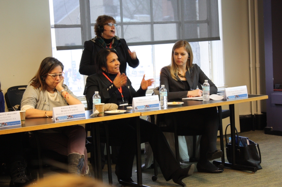 A delegate asks a question via an interpreter.