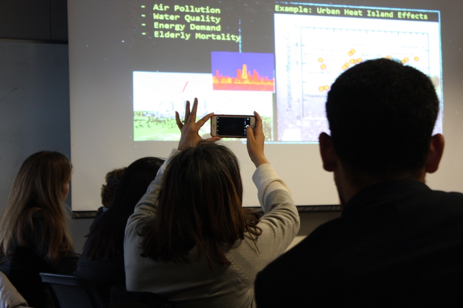 Modern note-taking: A USTDA delegate takes note of information during the presentation. 