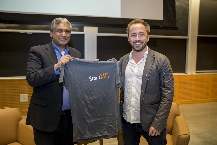 EECS department head Anantha Chandrakasan, the Vannevar Bush Professor of Electrical Engineering and Computer Science, presents a StartMIT T-shirt to Drew Houston '05.