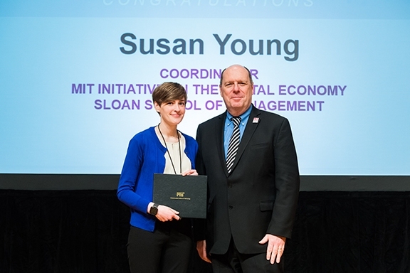 Susan Young is presented with the Serving the Client Award from Provost Martin Schmidt.