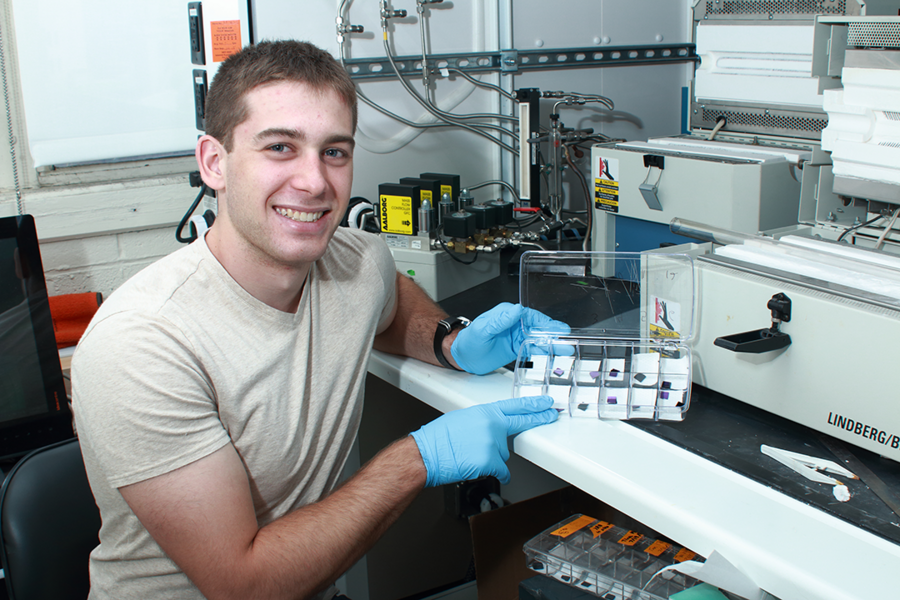 Summer Scholar Alexander Constable holds a case with samples of aligned carbon nanotube (CNT) nanocomposites with a carbon matrix, during his 2015 internship under professor of aeronautics and astronautics Brian L. Wardle. He contributed to a paper led by postdoc Itai Stein published in the scientific journal Carbon. 