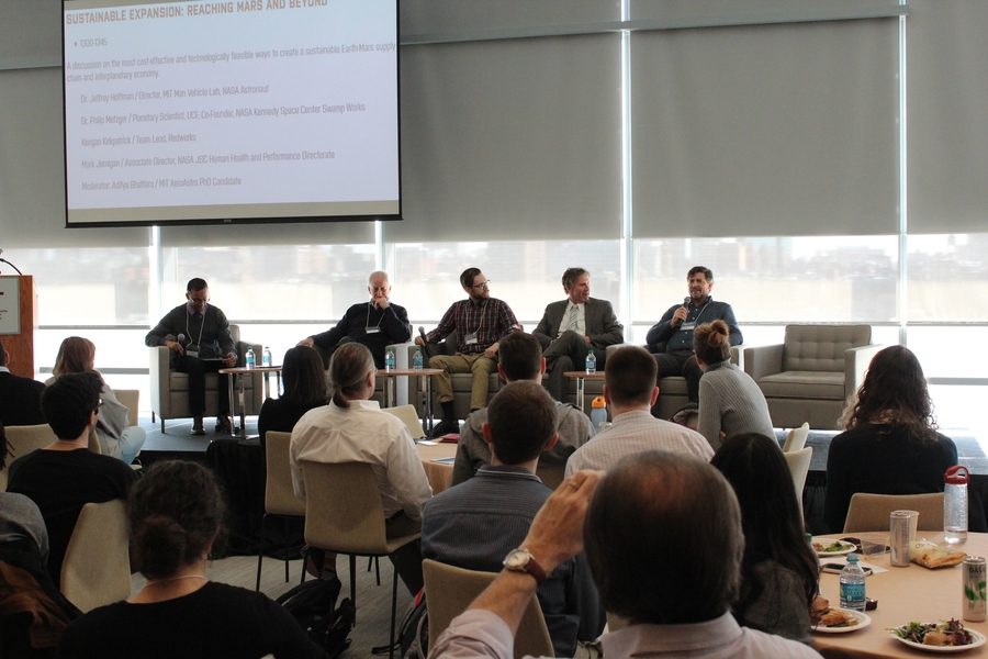 A panel on the exploration and colonization of Mars included (from left) Moderator: Aditya Bhattaru, a graduate student in AeroAsro; Jeffrey Hoffman, a former NASA astronaut, professor of the practice in AeroAstro, and director of the MIT Man Vehicle Lab; Keegan Kirkpatrick, team lead, RedWorks; Mark Jernigan, associate director, NASA Johnson Space Center Human Health and Performance Directorate; ...
