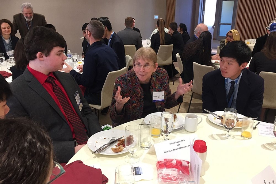 Professor Joanne Stubbe (center) speaks with Dylan Desrosiers (left) and Brian Du.