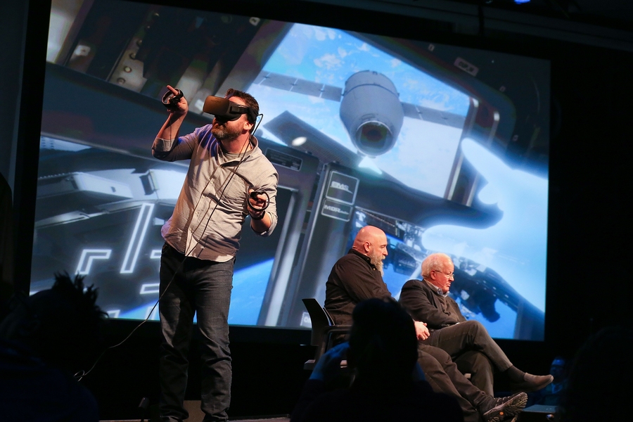 In the plenary panel on “living a sci-fi space future,” Ben Grossmann, co-founder and visual effects supervisor at Magnopus, demonstrated a virtual reality experience he helped to develop of the International Space Station. His fellow panelists (left to right), sci-fi author Warren Ellis and movie visual effects pioneer Doug Trumbull, watched Grossmann’s VR movements on the screen.