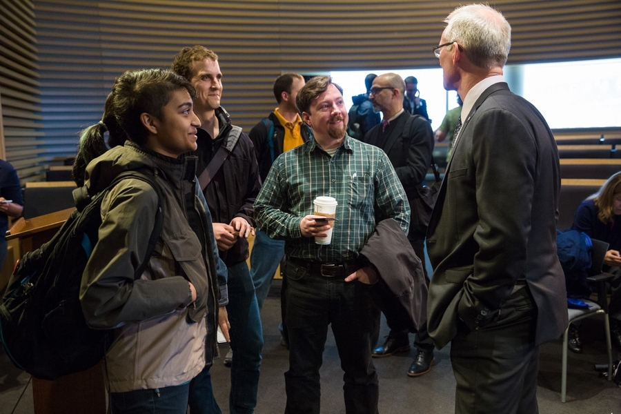 Bob Inglis (right) speaks with audience members following his talk at MIT on April 25.