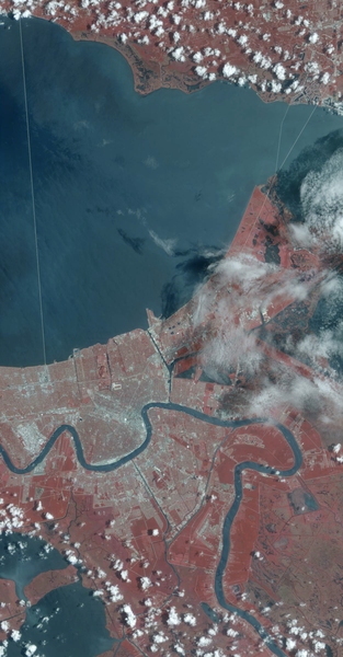 In this portion of a July 21, 2002 scan of New Orleans, the image has been color-processed to reflect data collected from multiple bands, including infrared, which shows up as the bright red. 