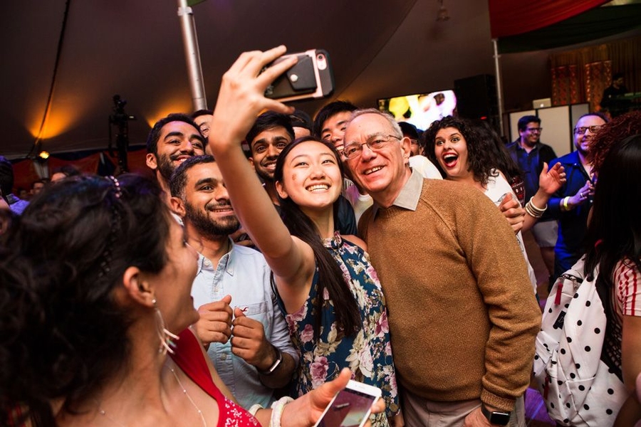 MIT President L. Rafael Reif posed for a selfie with partygoers at the OneWorld @ MIT Multicultural Festival and Dance Parties on April 29.
