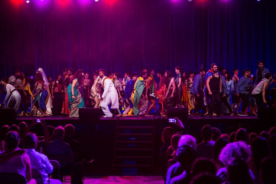 All the performers took the stage for the grand finale and danced, with the audience singing along, to K’naan’s “Wavin’ Flag.”
