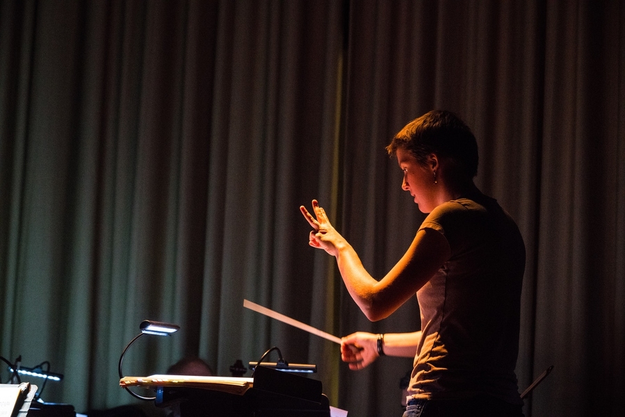 Gilbert and Sullivan Players Music Director Lorraine Fitzmaurice leads the orchestra during a recent dress rehearsal. A Boston resident, she learned of the group by word-of-mouth.