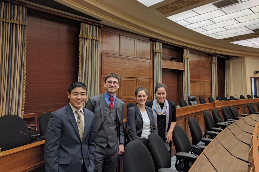 Left to right: Matthew Chun, Jack Reid, Erin Rousseau, and Tiziana Smith in the meeting room for the House Committee on Science, Space, and Technology.