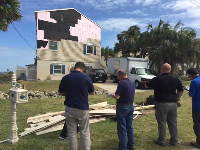 Inspectors assess the damage to a home on the Florida coast following Hurricane Matthew, which struck in October 2016.