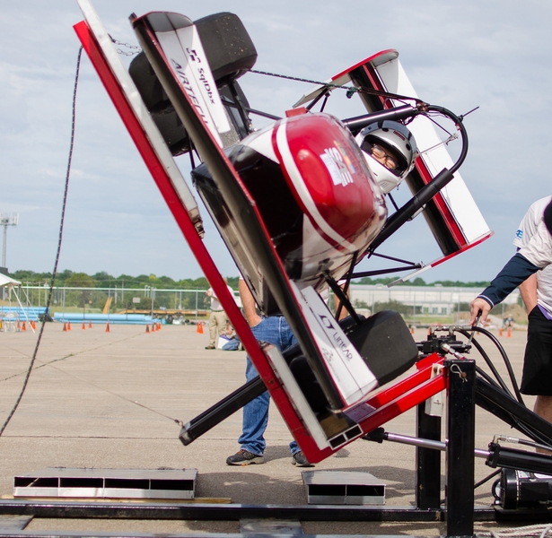 The MIT Motorsports vehicle and driver Kevin Chan undergo the tilt test during technical inspection. In order to pass, the car must be capable of being tilted to a 60-degree angle without leaking any fluids.