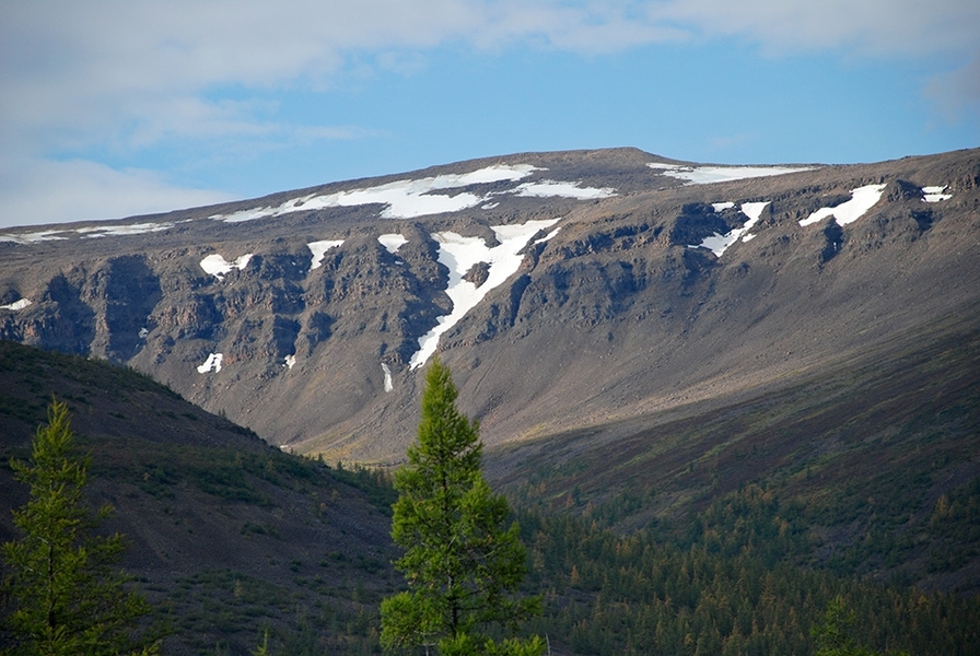 Geologists report that about 251.9 million years ago, a huge pulse of magma rose up through the Earth, in a region that today is known as the Siberian Traps.