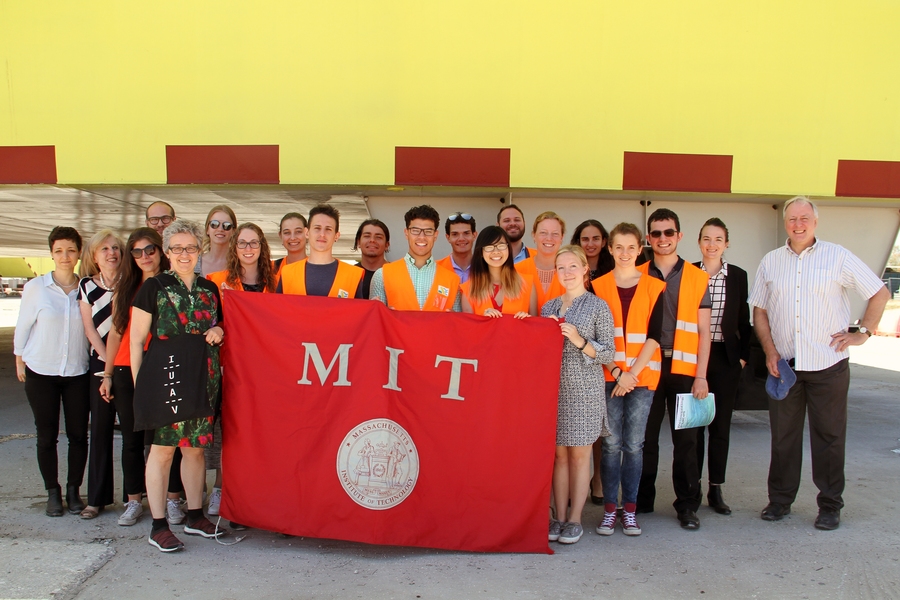 MIT students, students from the University of Venice, and faculty members from both institutions pose in front of Venice's experimental floodgates as part of a collaborative summer workshop. 
