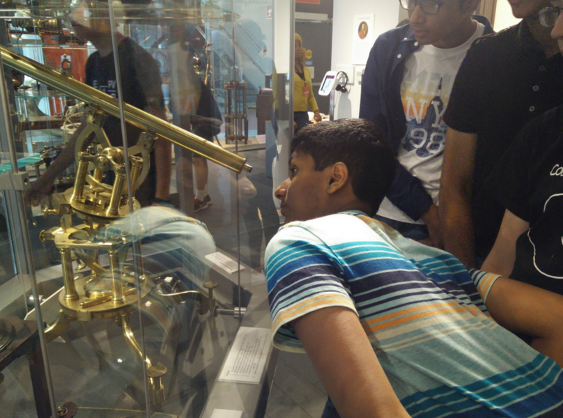 MIT Astronomy Training Camp attendees view historical telescopes at the Harvard Museum.