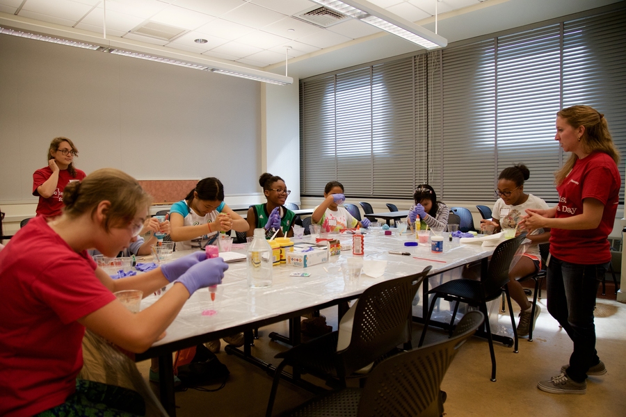 Measuring out glue and borax for home-made bouncy balls at the Chemistry in Materials Experiment Station.