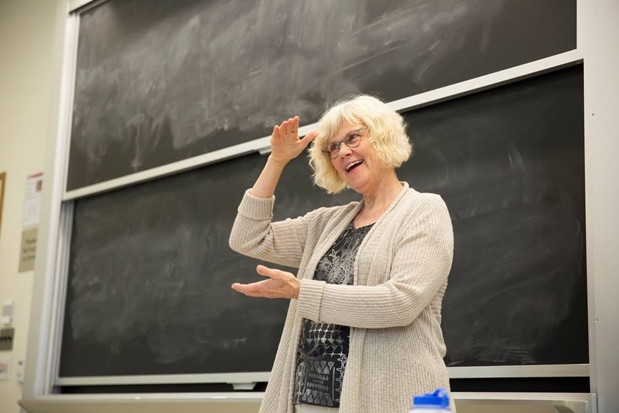 American Sign Language Instructor Carol Zurek shows ASL gestures during classroom discussion.
