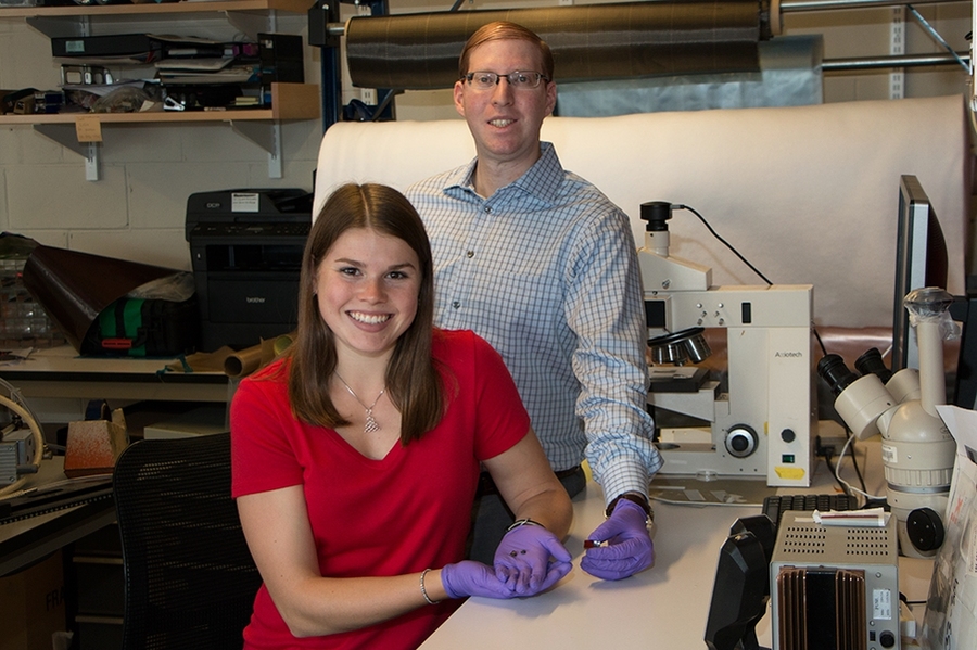 Research by MIT graduate student Ashley Kaiser (left) and postdoc Itai Stein shows that a small fraction of carbon nanotubes added to phenol-formaldehyde resin lowers the processing temperature needed to achieve the best combination of hardness and low density by 200 degrees Celsius.