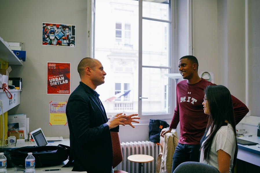 Plume Labs CEO Romain Lacombe SM '08 (left) discusses product prototyping with MIT alumni interns Carrington Motley ’16 (center) and Annie Dai ’17.