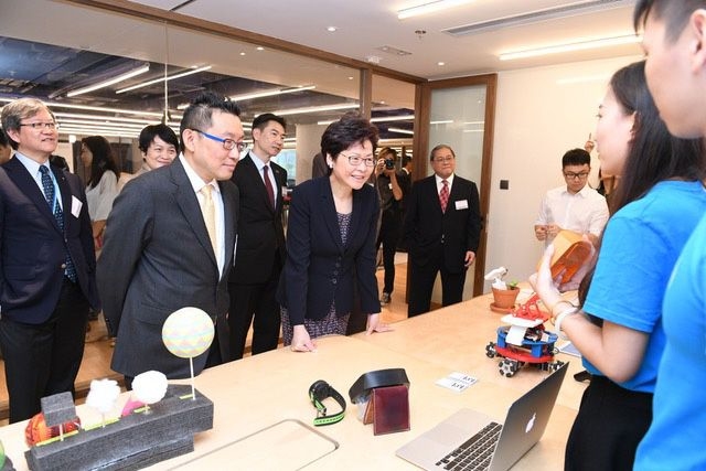Carrie Lam listened to students’ introductions of their projects created during the Node’s educational program.