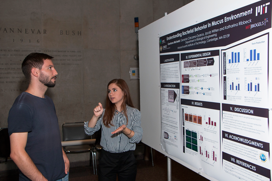 2017 MPC-CMSE Summer Scholar Gaetana Michelet discusses her summer internship on “Understanding Bacterial Behavior in a Mucus Environment” with MIT materials science graduate student Luca Barloggio (left) during the annual MPC-CMSE Summer Scholars Poster Session on Aug. 3, 2017.