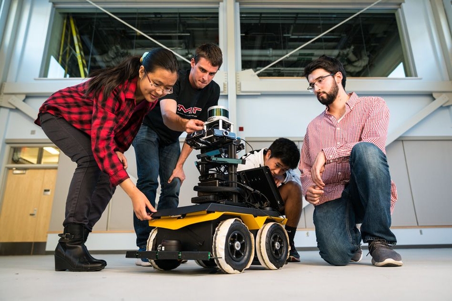 Yu Liang (Gloria) Fang, at left, says NEET’s Autonomous Machines thread appeals to her because it involves hands-on projects. She is joined by Michael Everett, Albert Go, and Mitchell Guillaume.