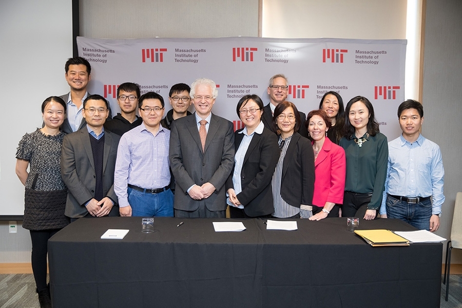 MIT Associate Provost Richard Lester, center left; MIT associate professor Siqi Zheng, the founding faculty member of the China Future City Lab, center right; along with MIT staff and researchers, at the lab's launch event, November 17, 2017.