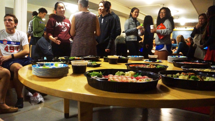 Baker residents gather together over sushi and conversation during their MindHandHeart-sponsored study break.