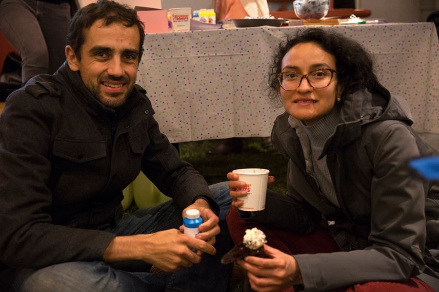 Members of the MIT community enjoy cupcakes on the indoor lawn.