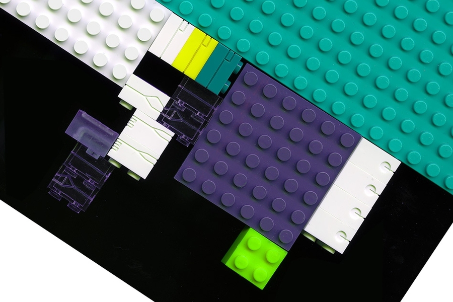 A close-up of LEGO bricks, milled with tiny fluidic channels.