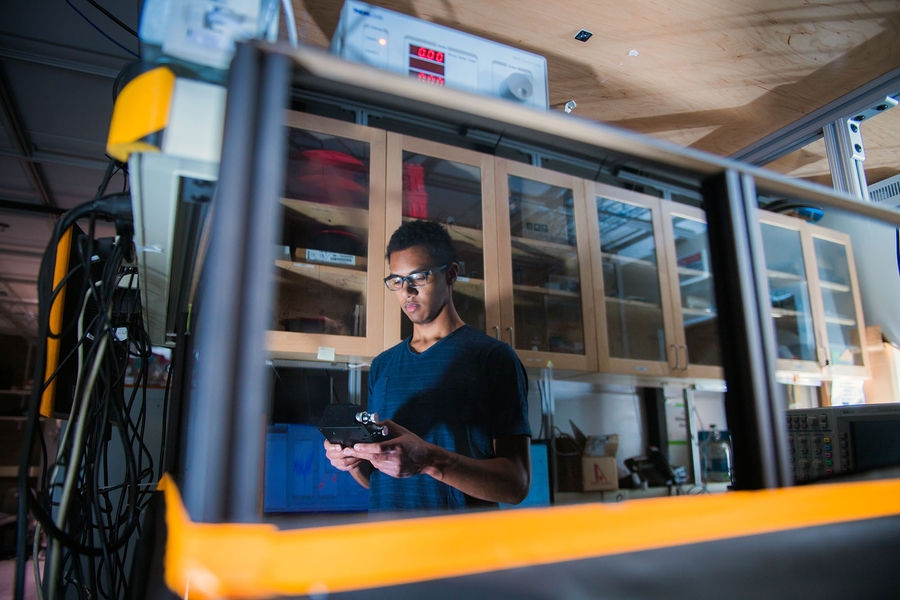 EECS senior Ronald Davis' SuperUROP project, "Driving a Nitrogen Vacancy with a Microscale CMOS Inductor," involves both quantum mechanics and electrical engineering.