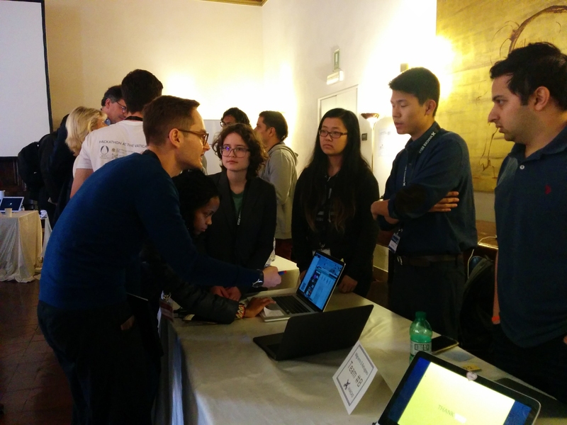 MIT students showcase their platform Sajal, a lightweight cross-border electronic medical record for refugees, during the VHacks expo.
