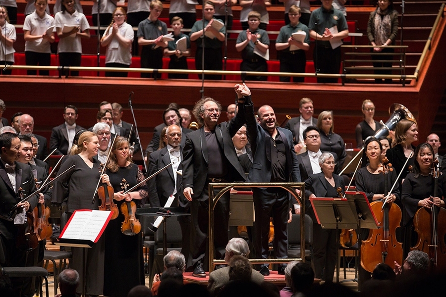 MIT composer Tod Machover, center-left, and Yannick Nézet-Séguin, conductor of the Philadelphia Orchestra, center-right, at the conclusion of Machover’s new symphony “Philadelphia Voices,” at the Kimmel Center in Philadelphia, Thursday, April 6, 2018.