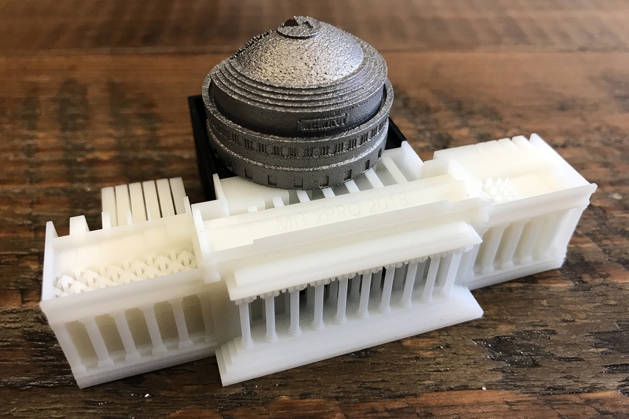 A new online course from MIT and Boeing uses a 3-D-printed kit to enrich the learning experience. Similar to a textbook, the kit is used as a reference throughout the course. The kit has metal and polymer parts made by industry-relevant 3-D-printing processes, including stereolithography, multi-jet fusion, and direct metal laser sintering. The parts interlock to form a model of MIT's iconic Buildi...