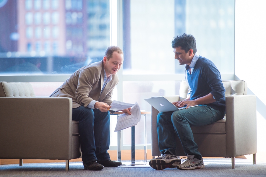 Among many other activities, Vinod Vaikuntanathan co-directs the annual EECS Masterworks poster session, which highlights master's students’ thesis research. Here, he and Masterworks co-director Dirk Englund, also an associate professor of EECS, compare notes for the Masterworks 2017 best poster awards.