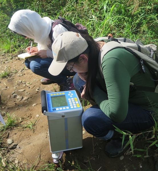 MIT graduate students record data from a gravitometer in St. Lucia.