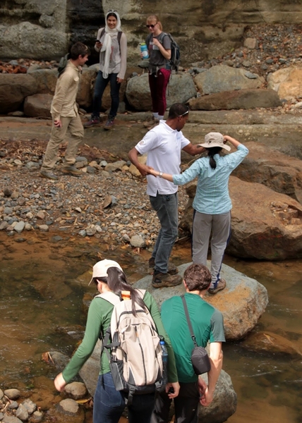MIT students cross the Roseau River in St. Lucia.