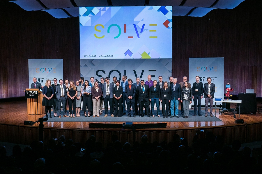 MIT President Rafael Reif (far left) presents Solver teams at the opening plenary of Solve at MIT 2017.