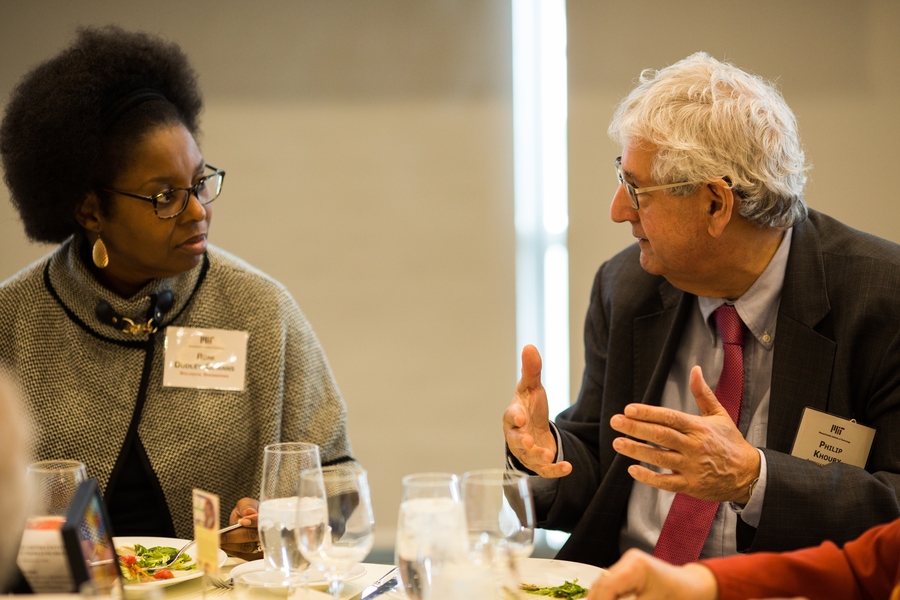 New inductee Rolanda Dudley-Cowans of the Department of Biological Engineering (left) and featured speaker Associate Provost Philip Khoury share MIT memories.