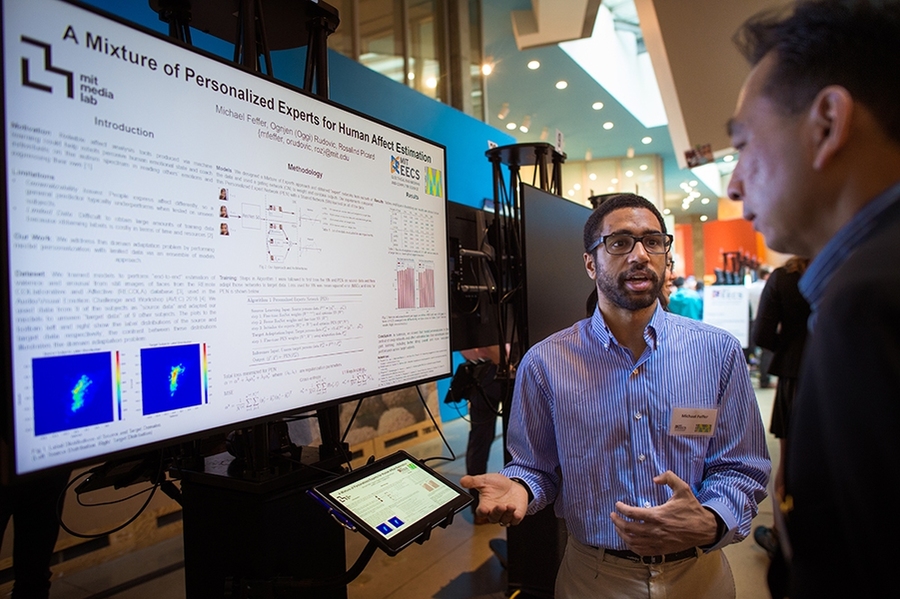 Xavier Puig, shown here discussing his research project "VirtualHomes: Simulating Household Activities via Programs," was among nearly 50 students who presented during Masterworks 2018. 

