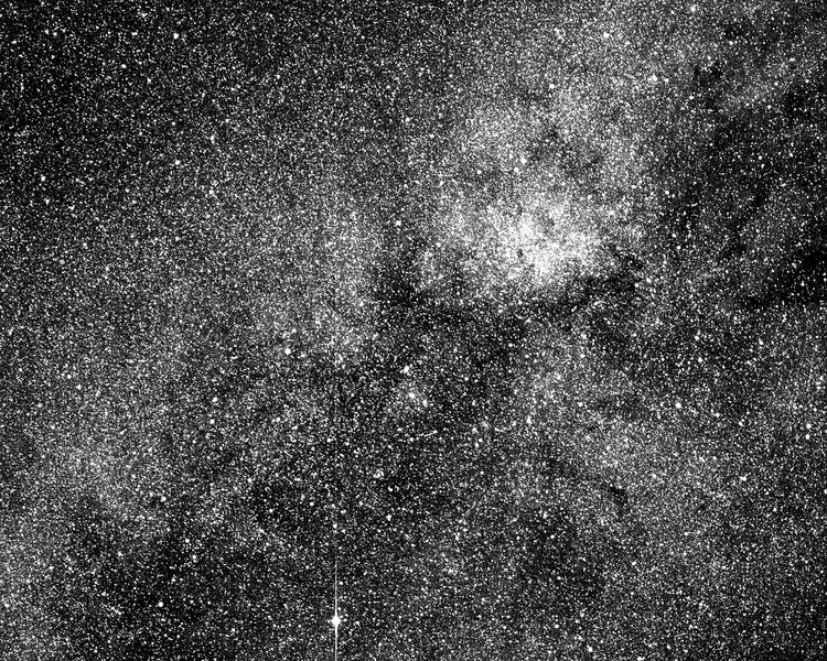 This test image from one of the four cameras aboard the Transiting Exoplanet Survey Satellite (TESS) captures a swath of the southern sky along the plane of our galaxy. More than 200,000 stars are visible. The image, which is centered in the constellation Centaurus, includes dark tendrils from the Coal Sack Nebula and the bright emission nebula Ced 122 (upper right).The bright star at bottom cente...