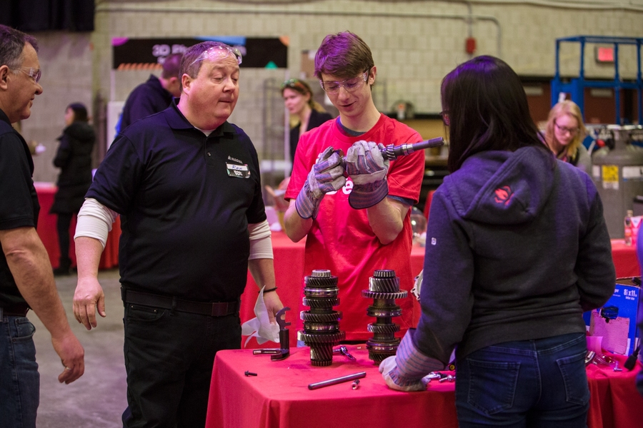 A student takes apart a transmission to see how it is put together at the machine autopsy station.