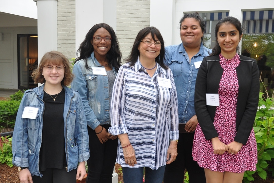 Lydia Villa-Komaroff (center) joins four MIT Summer Research Program students at the Building 68 retreat.