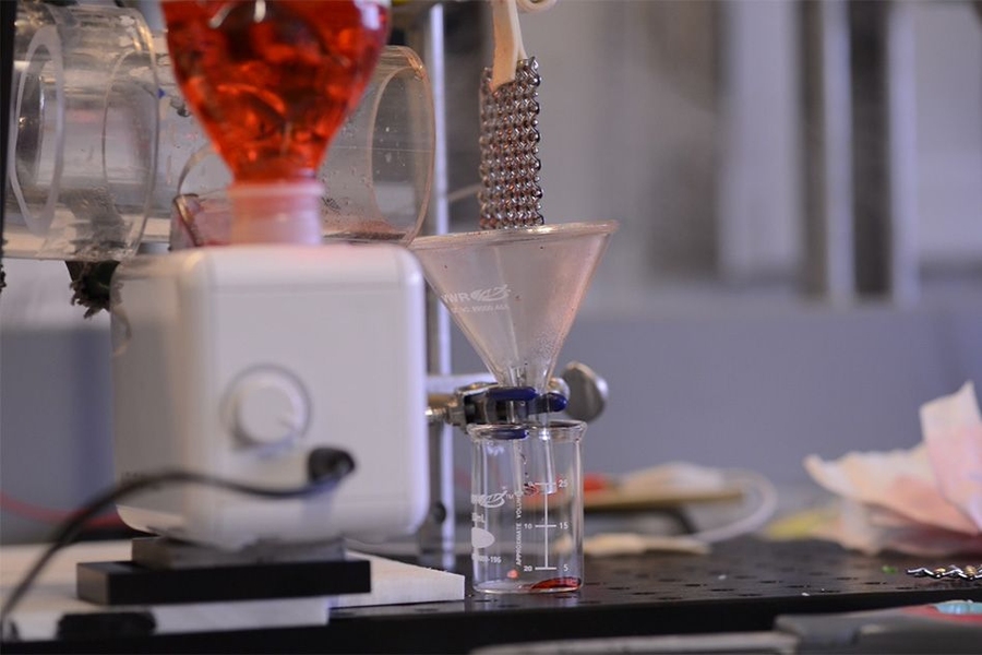 The team’s lab setup was used to test the powerplant condenser system. The mesh is placed above the funnel at right to collect the water that condenses on the mesh.